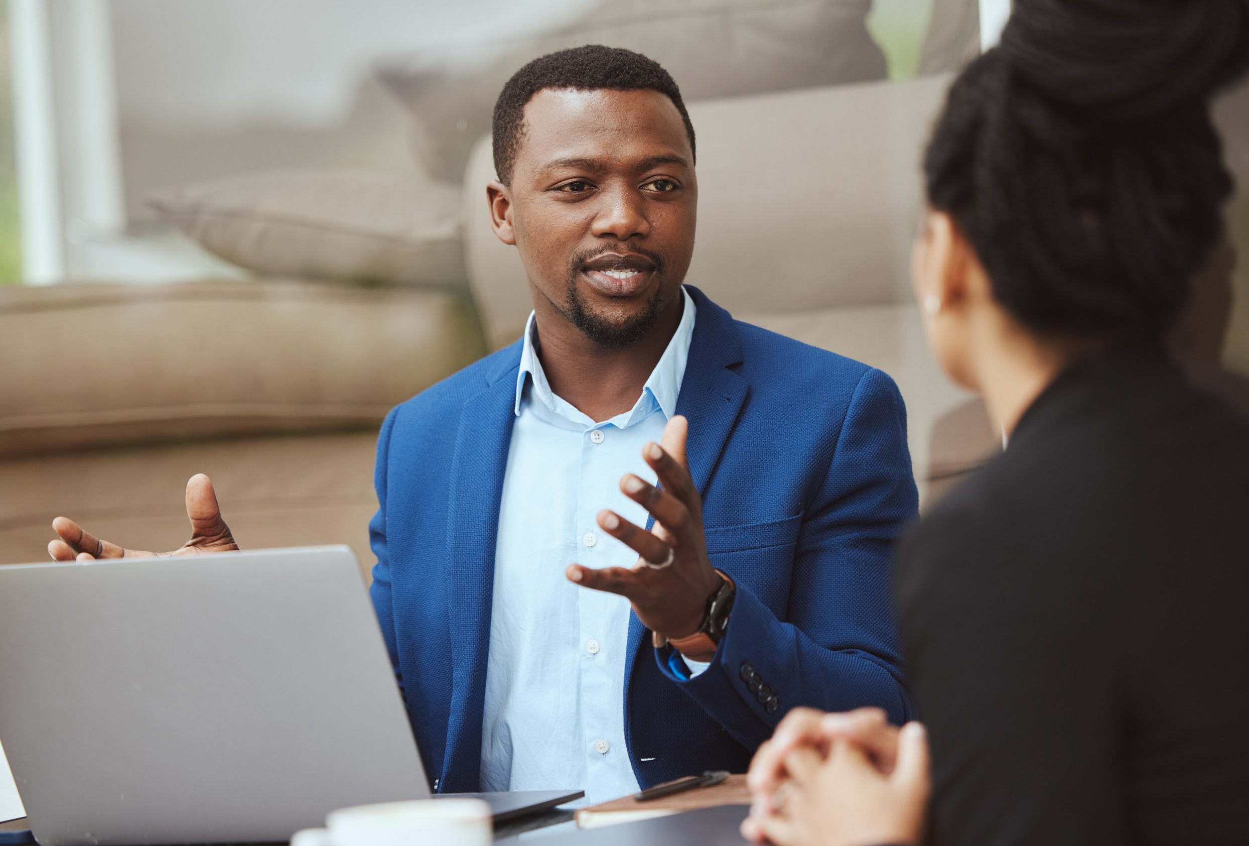 laptop, meeting and financial advisor with a business black man and woman client talking portfolio growth. computer, finance and accounting with a male and female employee working on investment